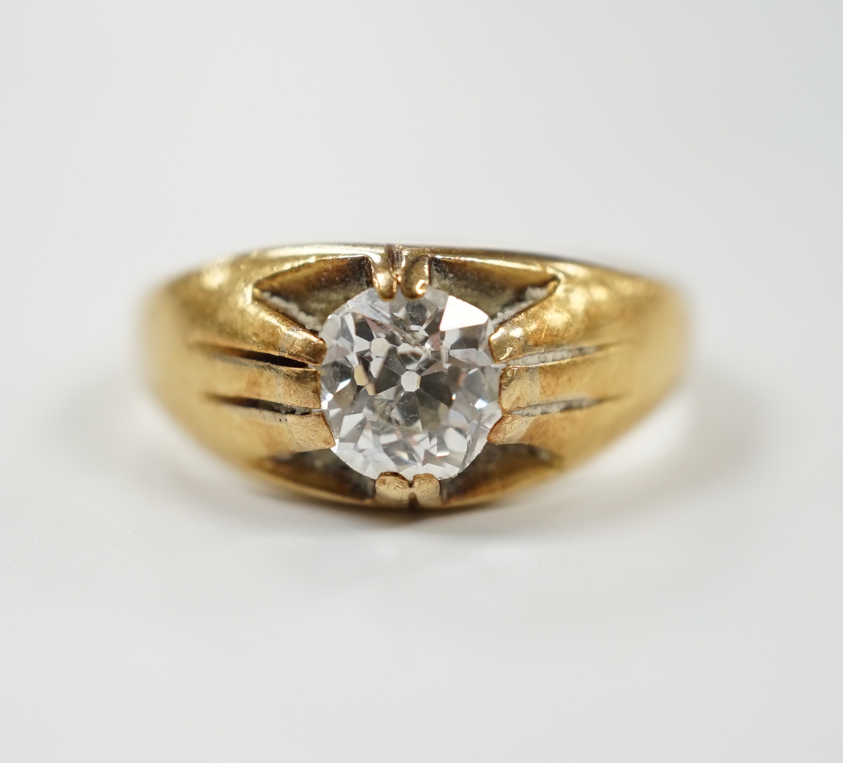 A late Victorian 18ct gold and claw set solitaire diamond ring, size P, gross weight 6.1 grams